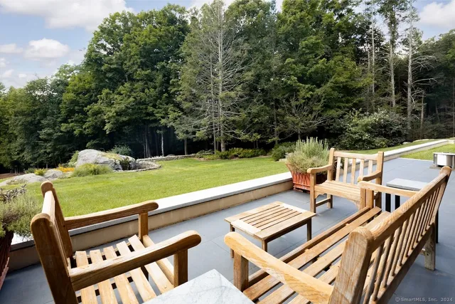 a view of a chairs and table on the deck