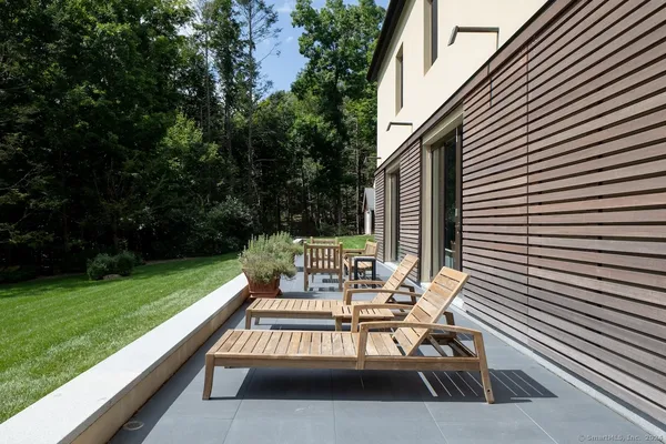 a view of a chairs and table on the deck