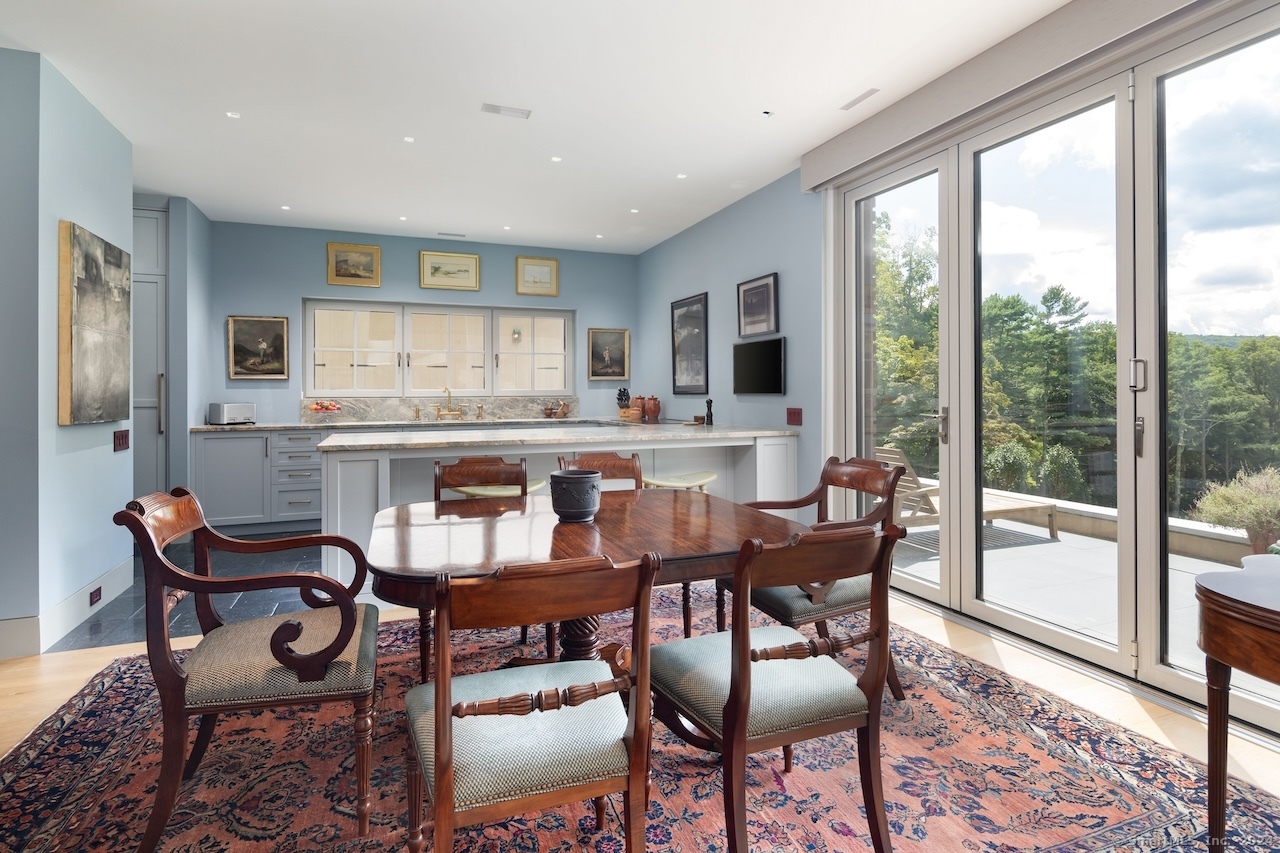 89 Under Mountain Road Canaan, CT 06031 - Photo 34 of 40 a view of a dining room with furniture window and outside view