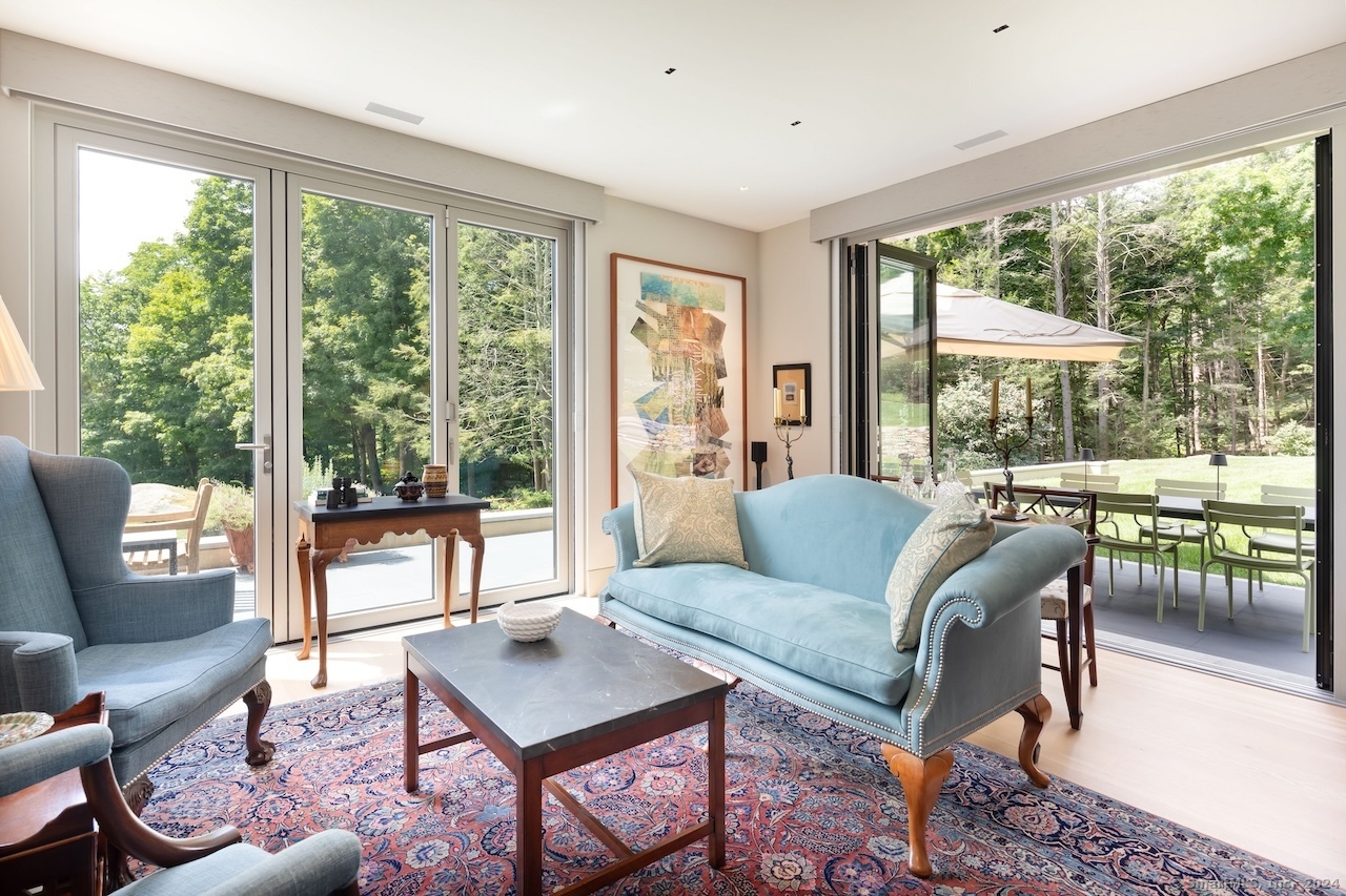 89 Under Mountain Road Canaan, CT 06031 - Photo 36 of 40 a living room with furniture and a large window