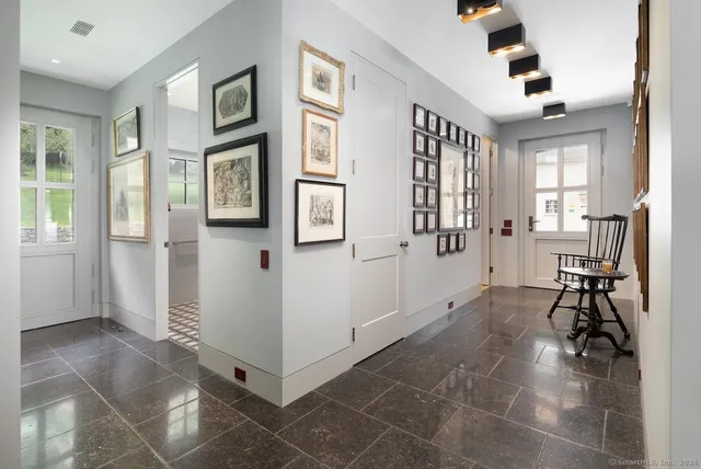 a view of a livingroom with furniture and windows