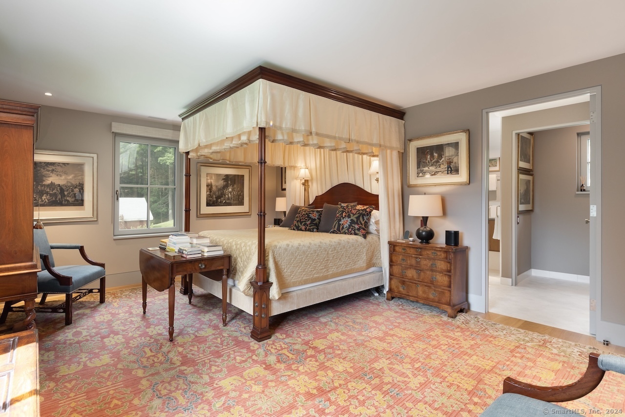 89 Under Mountain Road Canaan, CT 06031 - Photo 8 of 40 a bedroom with a bed and wooden floor