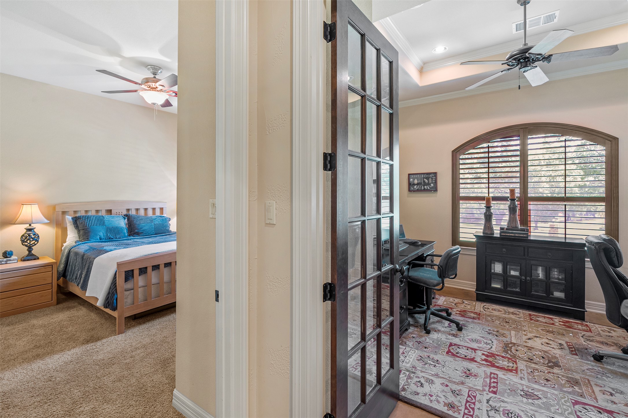 100 Portafino Lane Georgetown, TX 78633 - Photo 19 of 39 Bedroom featuring crown molding, a desk, a tray ceiling, a ceiling fan, and carpet floors