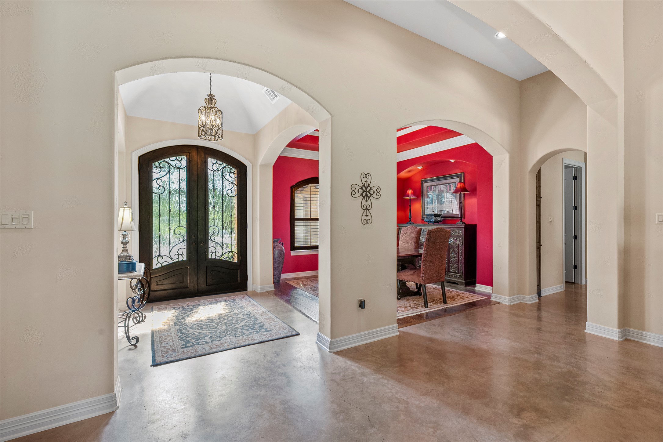 100 Portafino Lane Georgetown, TX 78633 - Photo 2 of 39 Foyer entrance with french doors, finished concrete floors, arched walkways, and a chandelier
