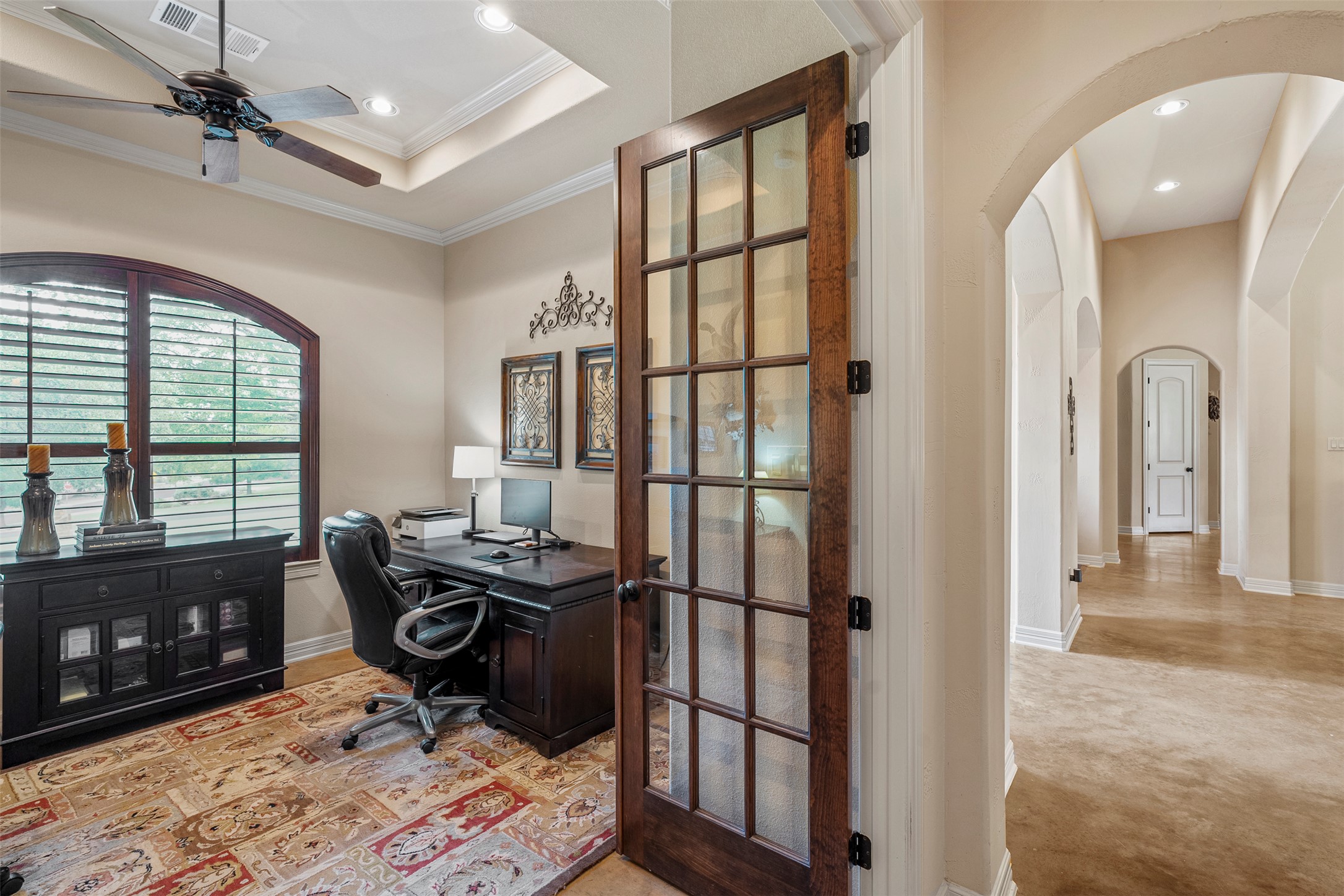 100 Portafino Lane Georgetown, TX 78633 - Photo 21 of 39 Home office with arched walkways, ceiling fan, ornamental molding, recessed lighting, and carpet flooring