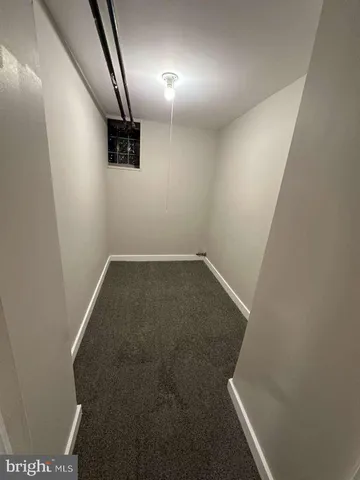 an empty room with staircase