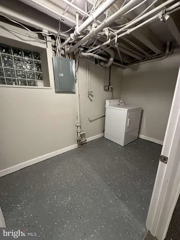 a view of a room with wooden walls