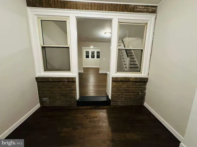 wooden floor view of an empty room with wooden floor and a window