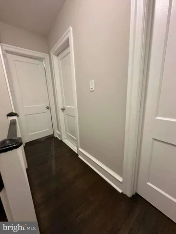 an empty room with wooden floor