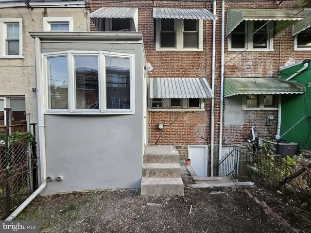 a view of a house with entrance gate