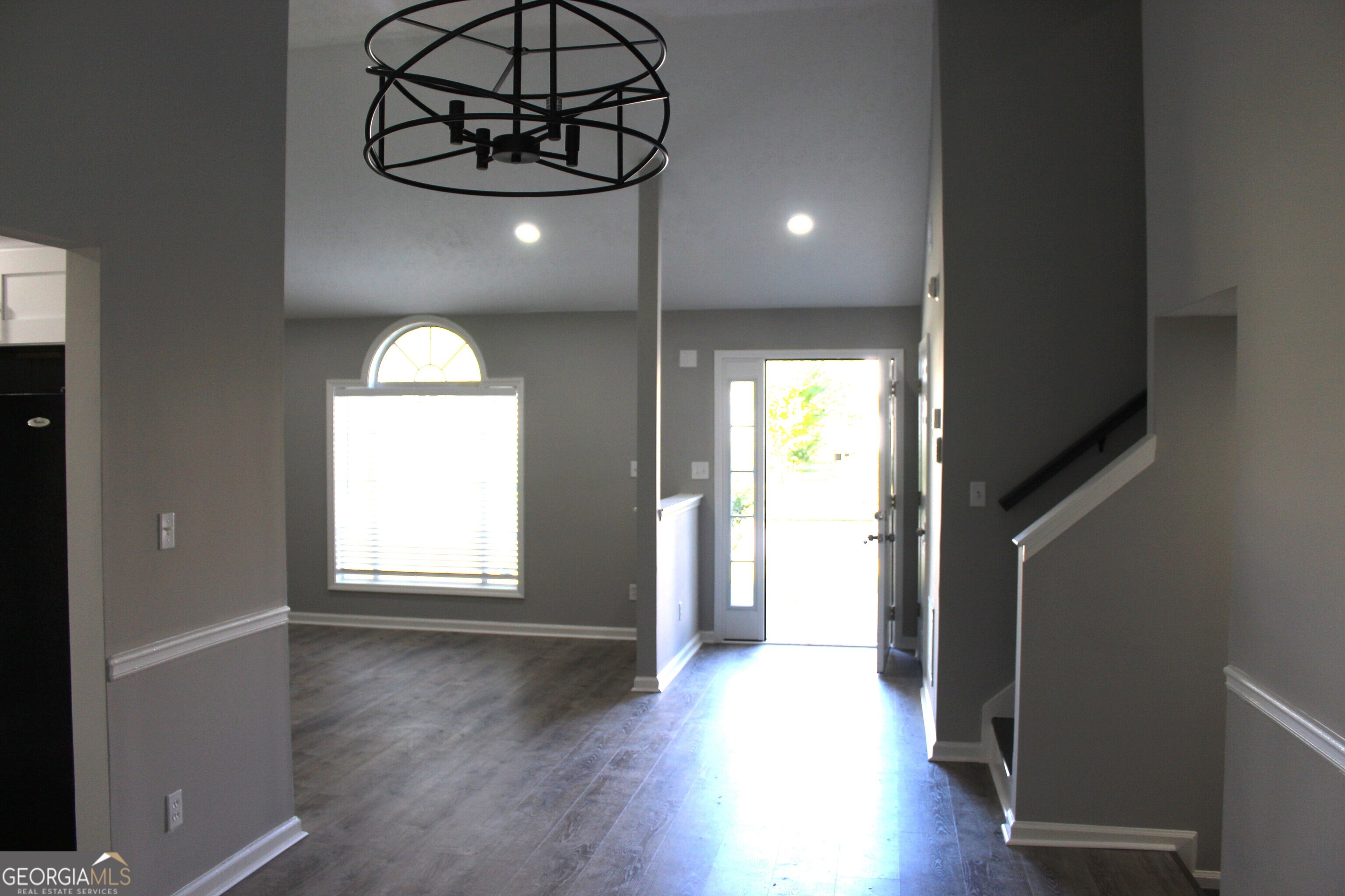 2640 Field Spring Drive Lithonia, GA 30058 - Photo 3 of 11 an empty room with wooden floor and windows