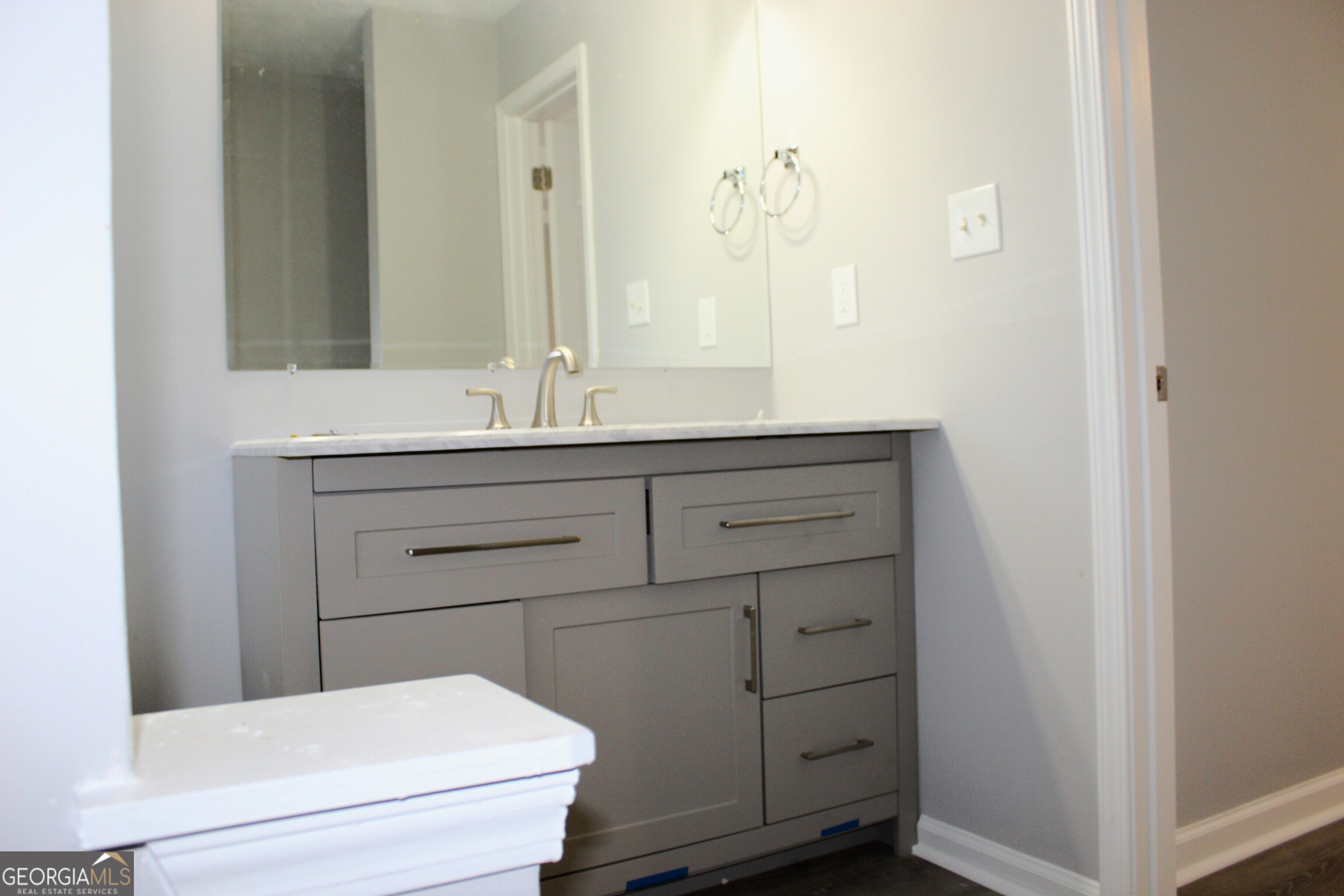 2640 Field Spring Drive Lithonia, GA 30058 - Photo 9 of 11 a bathroom with a sink a toilet and large mirror