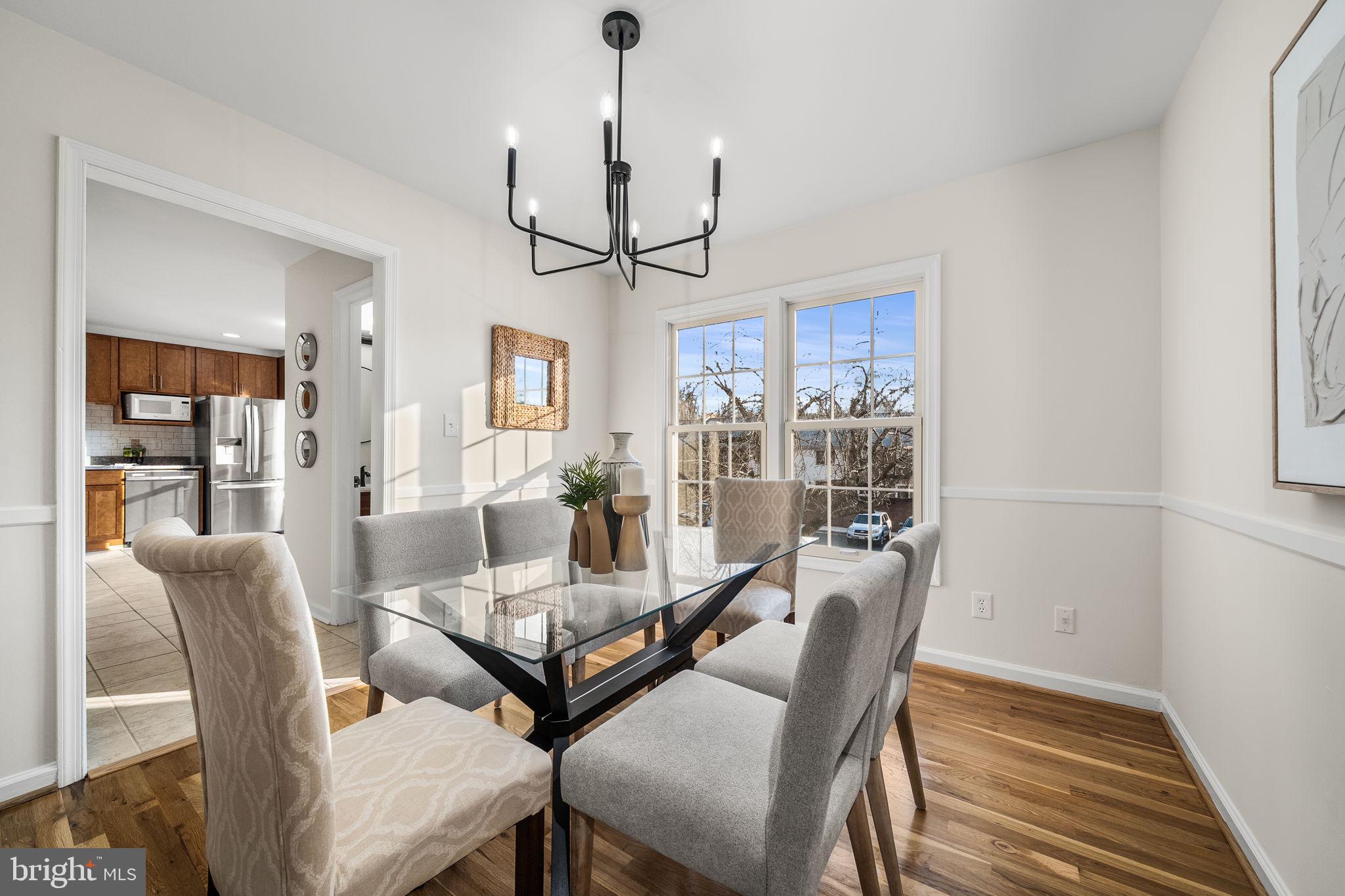 8333 Garfield Court Springfield, VA 22152 - Photo 12 of 60 a view of a dining room with furniture window and wooden floor