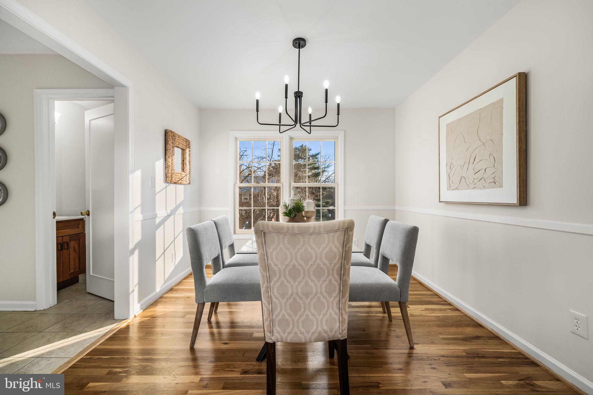 8333 Garfield Court Springfield, VA 22152 - Photo 13 of 60 a view of a dining room with furniture window and wooden floor