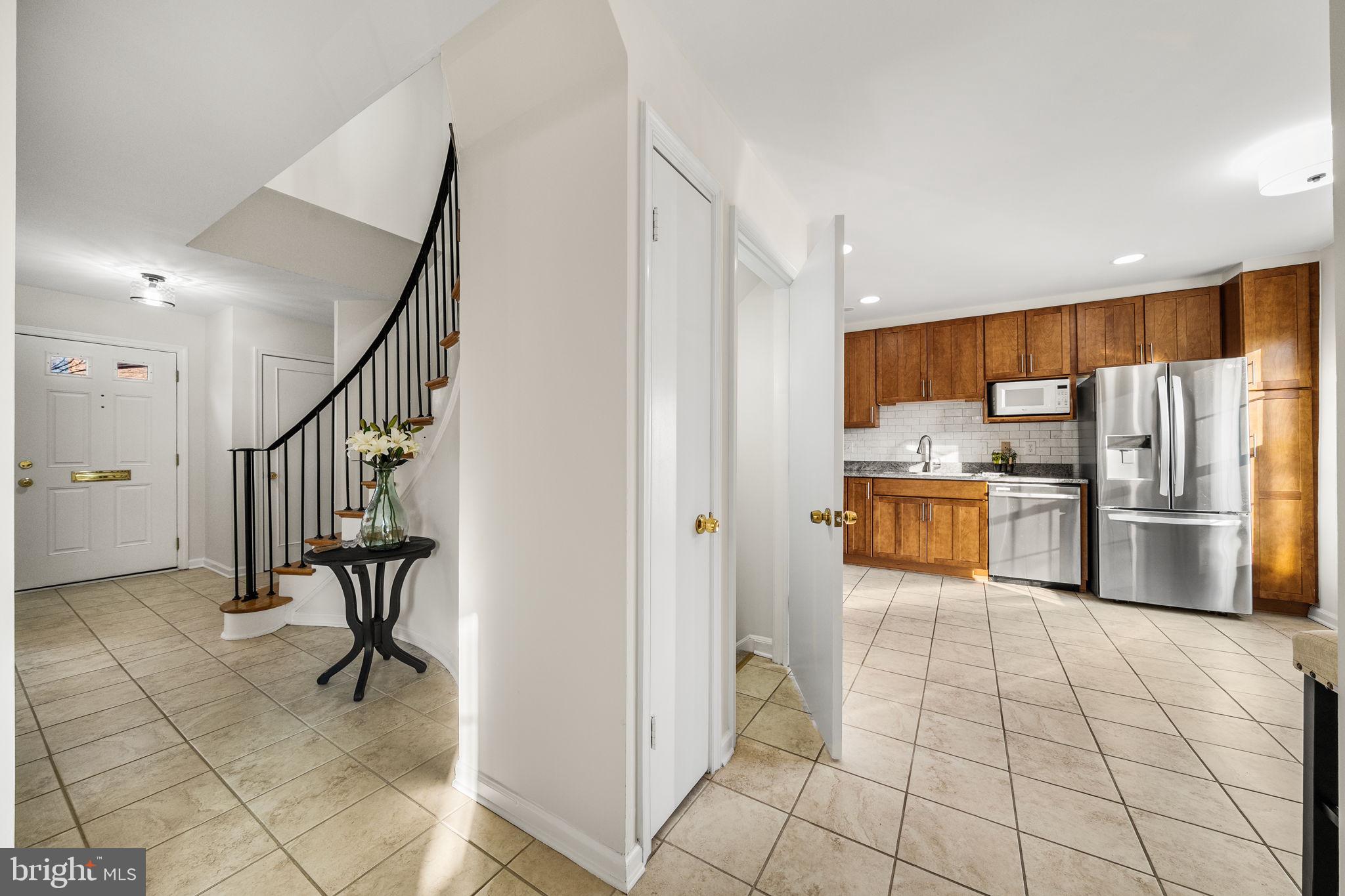 8333 Garfield Court Springfield, VA 22152 - Photo 16 of 60 a kitchen with stainless steel appliances a refrigerator and a stove top oven