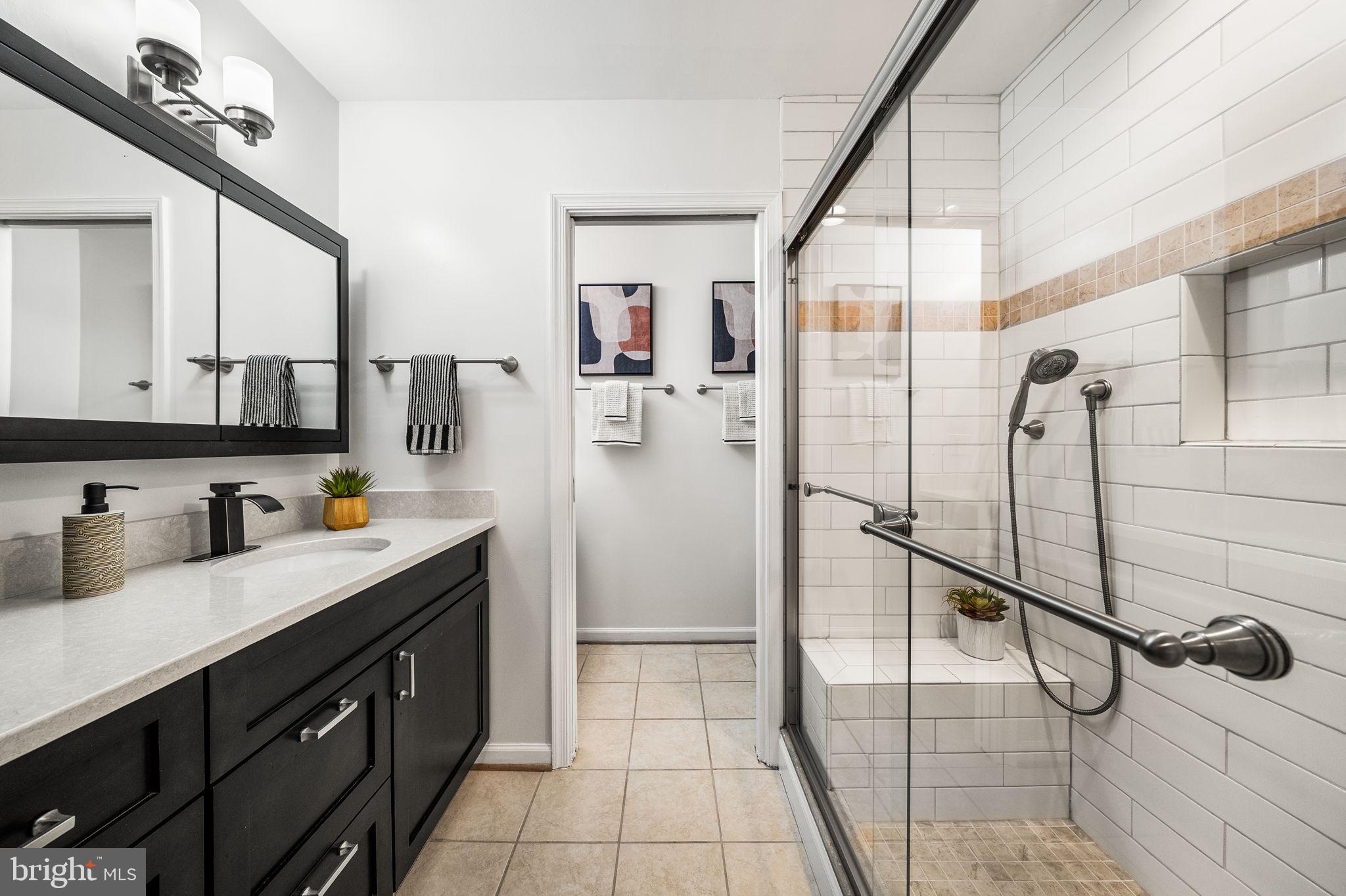 8333 Garfield Court Springfield, VA 22152 - Photo 34 of 60 a kitchen with a refrigerator and a sink