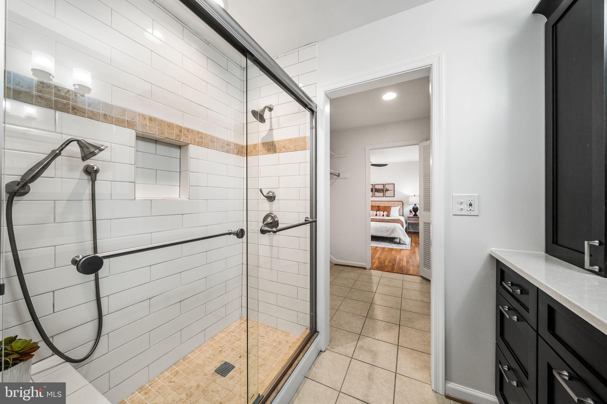 8333 Garfield Court Springfield, VA 22152 - Photo 35 of 60 a bathroom with a shower and a sink