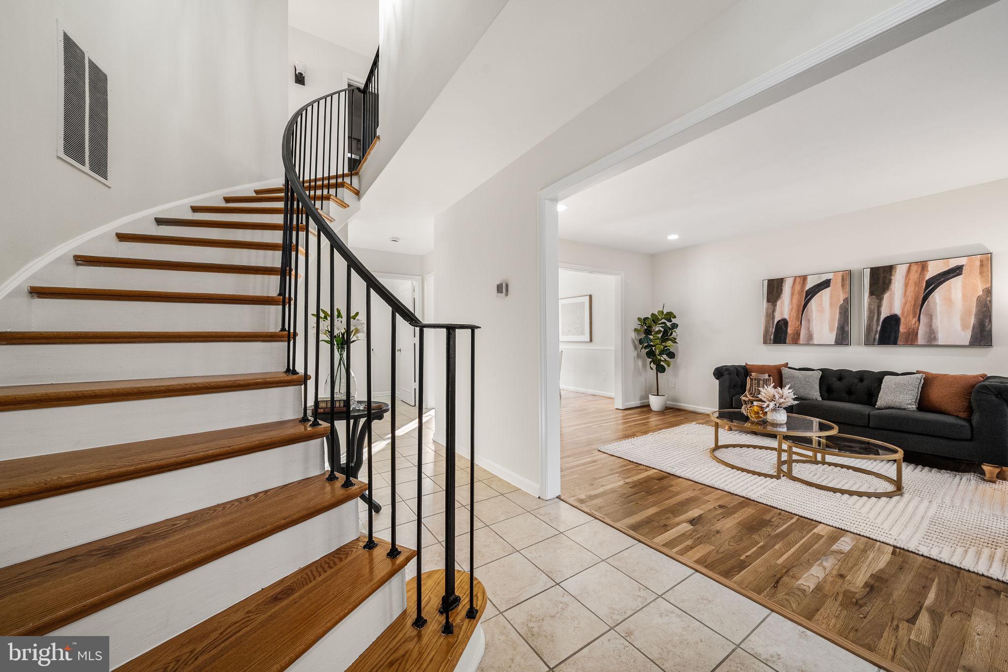 8333 Garfield Court Springfield, VA 22152 - Photo 5 of 60 a living room with furniture or stairs and a couch