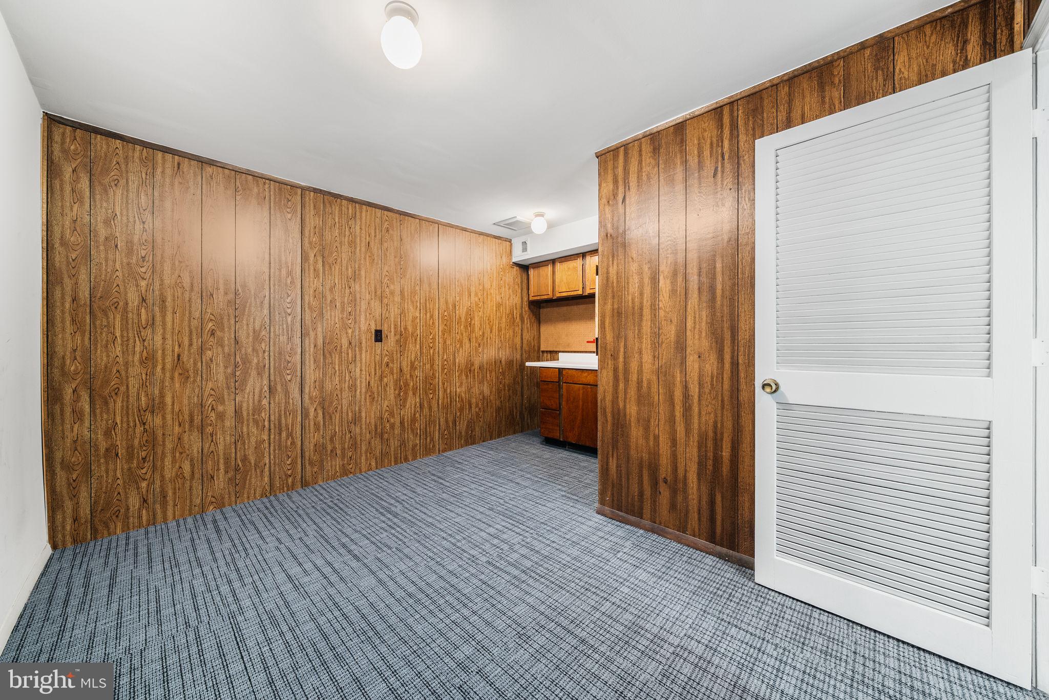 8333 Garfield Court Springfield, VA 22152 - Photo 51 of 60 a view of an empty room with wooden floor