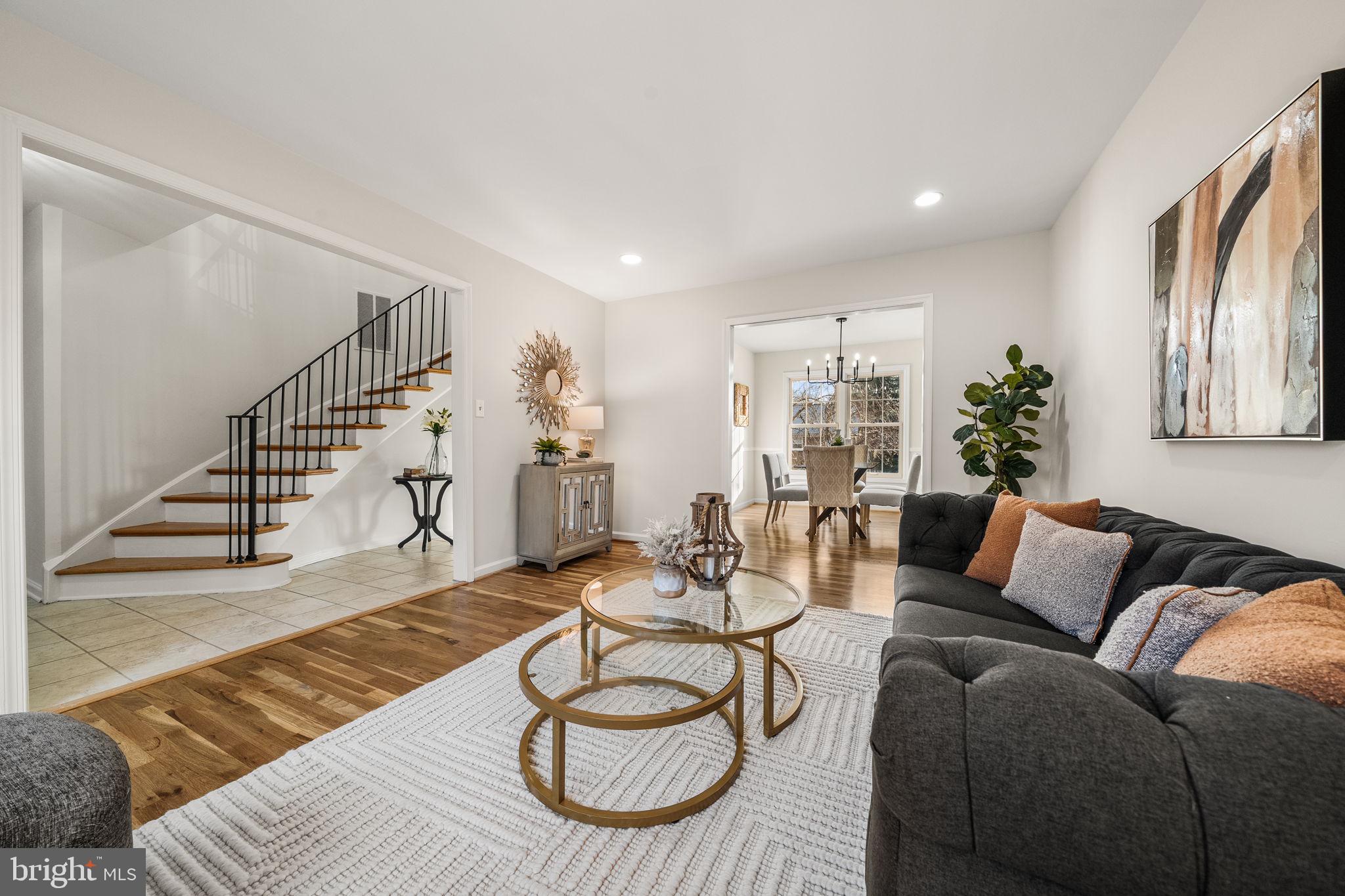 8333 Garfield Court Springfield, VA 22152 - Photo 6 of 60 a living room with furniture lamp and wooden floor