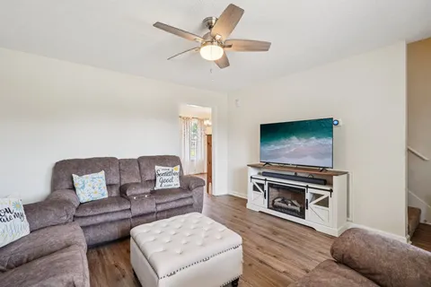 a living room with furniture and a flat screen tv