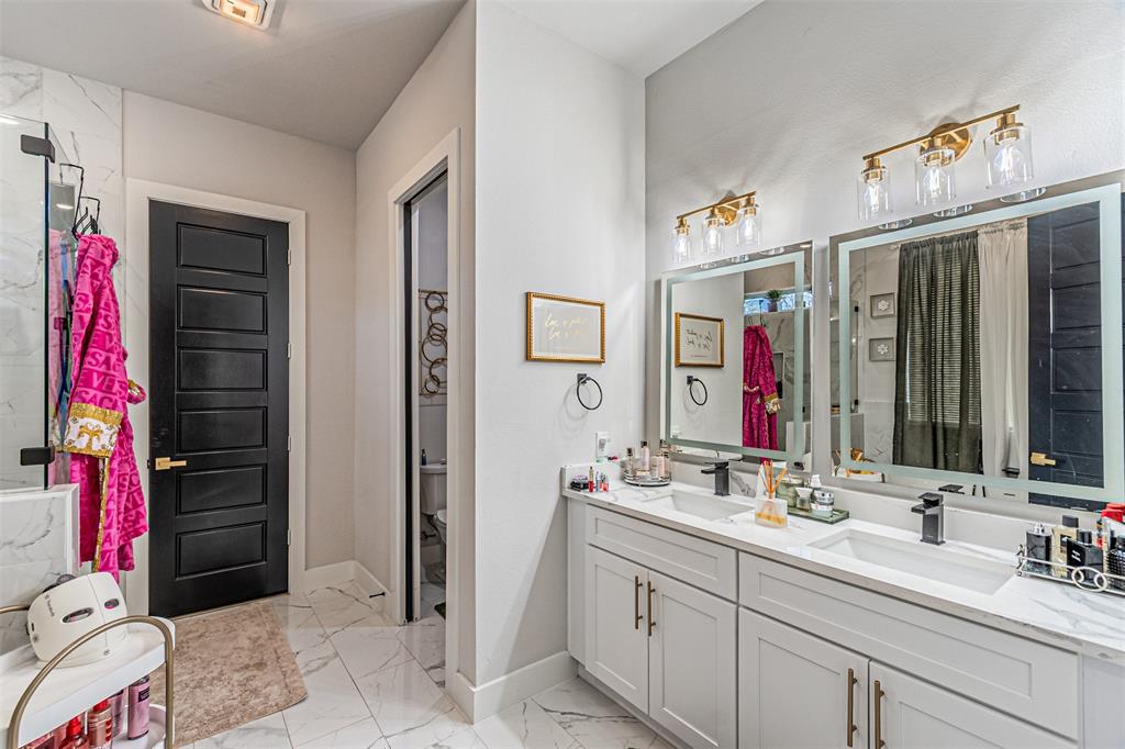 1503 Morrell Avenue Dallas, TX 75203 - Photo 17 of 30 a bathroom with a sink vanity and a mirror