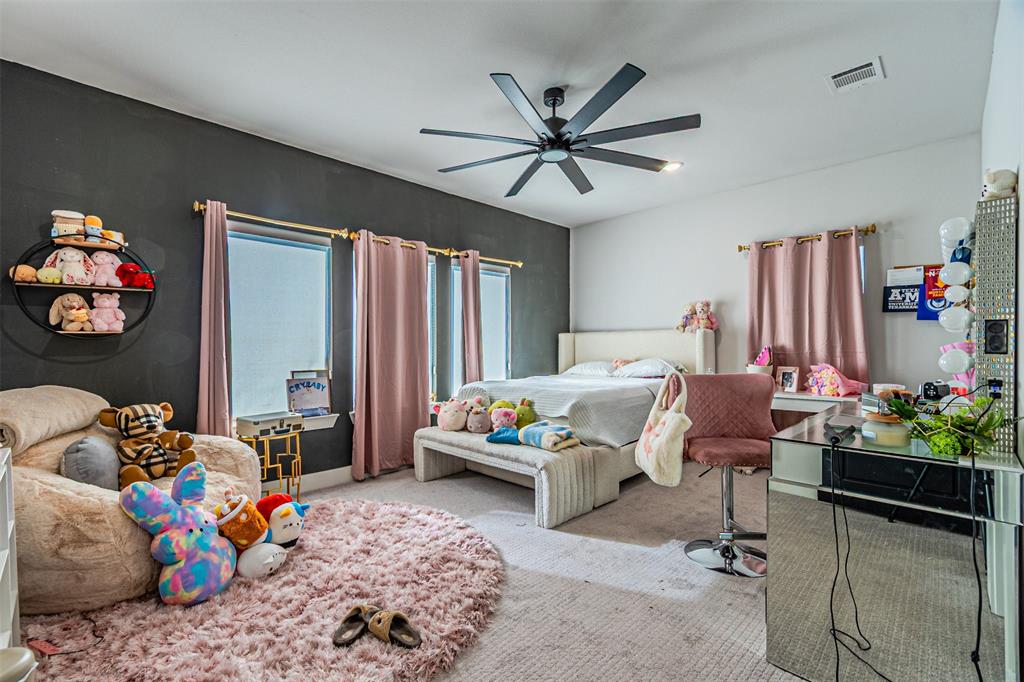 1503 Morrell Avenue Dallas, TX 75203 - Photo 20 of 30 a bed room with furniture and a rug