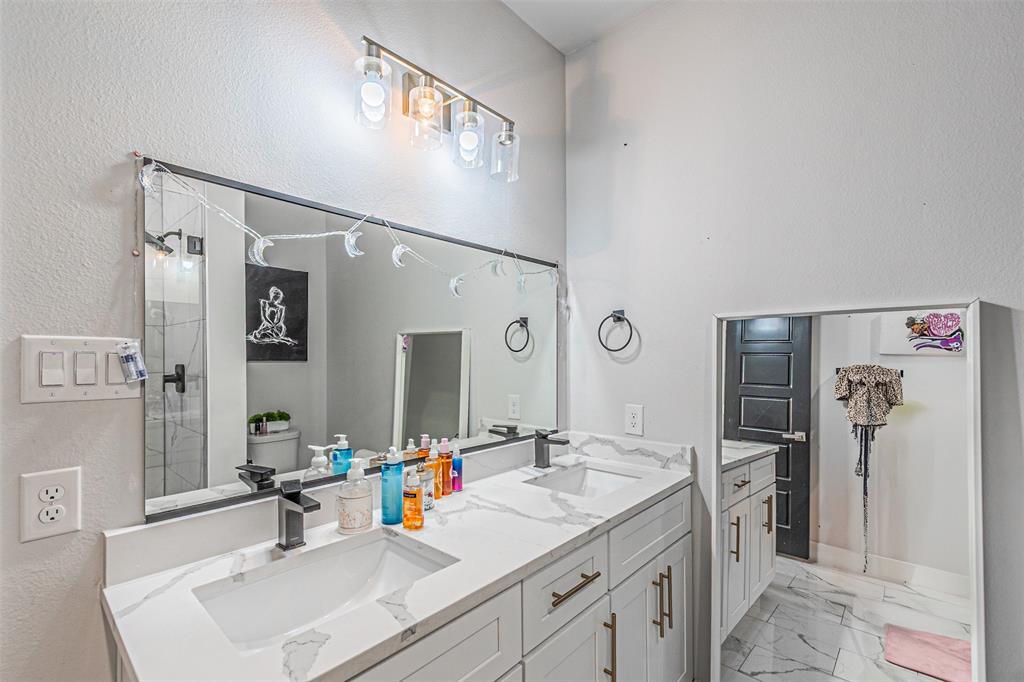 1503 Morrell Avenue Dallas, TX 75203 - Photo 22 of 30 a bathroom with a sink double vanity and a mirror