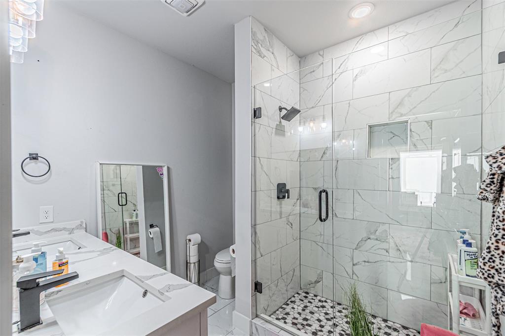1503 Morrell Avenue Dallas, TX 75203 - Photo 23 of 30 a bathroom with a sink toilet and shower
