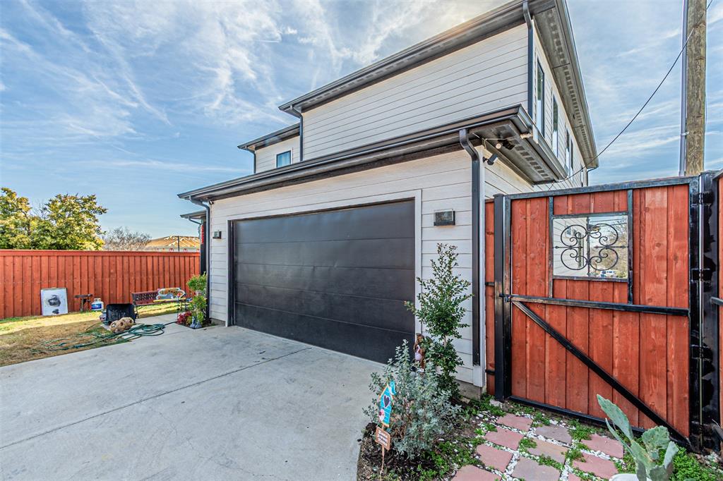 1503 Morrell Avenue Dallas, TX 75203 - Photo 29 of 30 a view of backyard with basket ball court and wooden fence