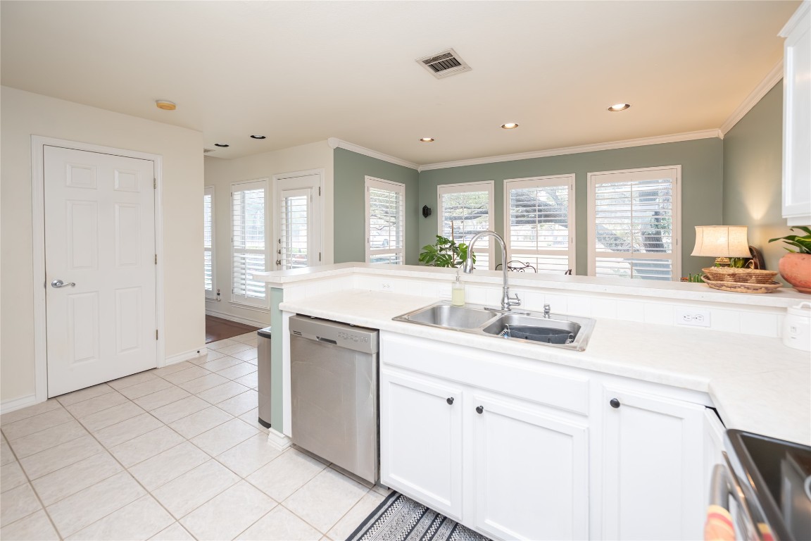 5402 Beacon Drive, Unit A Austin, TX 78734 - Photo 16 of 40 a kitchen with a sink and cabinets