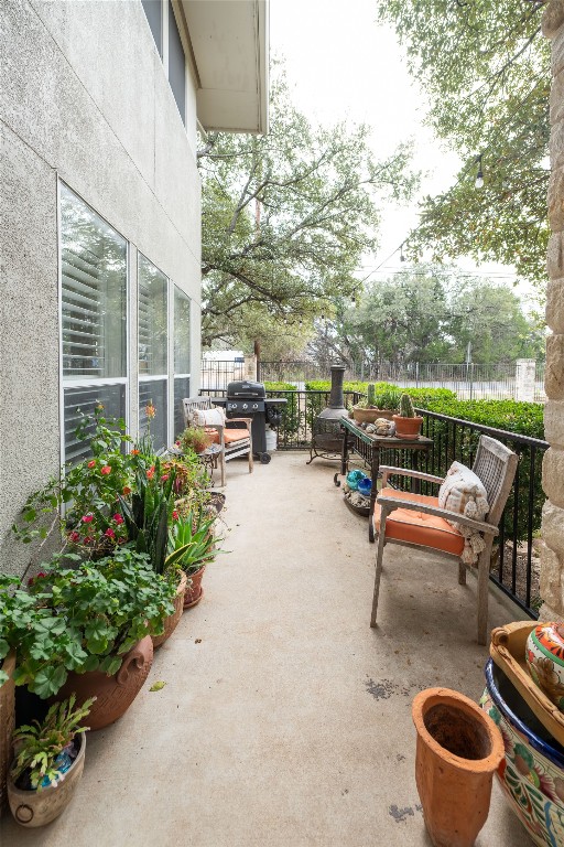 5402 Beacon Drive, Unit A Austin, TX 78734 - Photo 20 of 40 a terrace with outdoor seating and trees