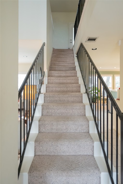 5402 Beacon Drive, Unit A Austin, TX 78734 - Photo 21 of 40 a view of staircase with wooden floor and white walls