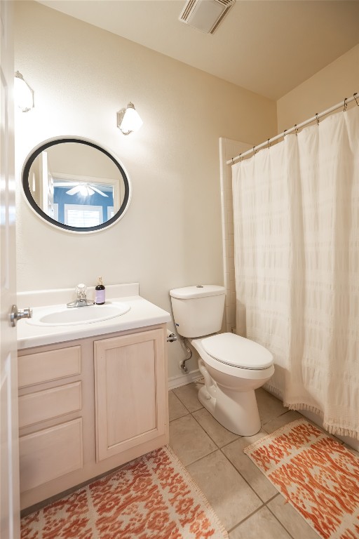 5402 Beacon Drive, Unit A Austin, TX 78734 - Photo 23 of 40 a bathroom with a toilet a sink and a mirror