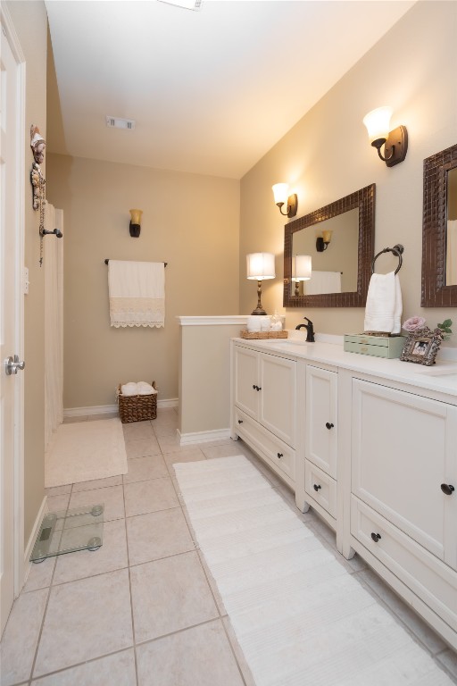 5402 Beacon Drive, Unit A Austin, TX 78734 - Photo 28 of 40 a spacious bathroom with a mirror sink and toilet