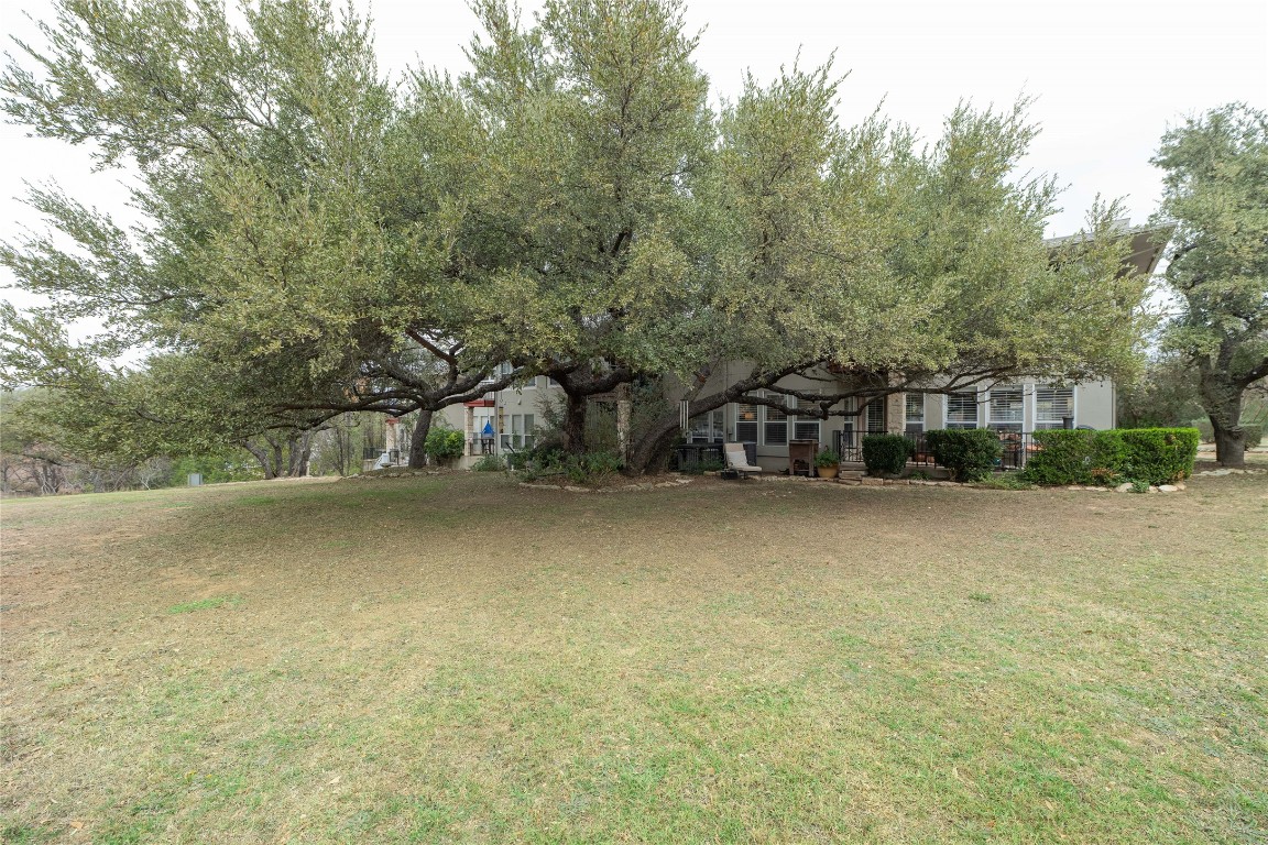 5402 Beacon Drive, Unit A Austin, TX 78734 - Photo 34 of 40 a view of a balcony with tree