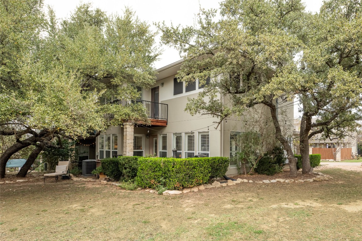 5402 Beacon Drive, Unit A Austin, TX 78734 - Photo 40 of 40 a view of a white house next to a road and trees