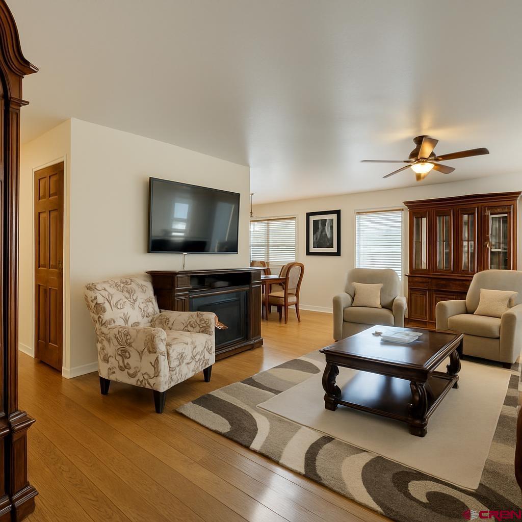 1711 Golf Course Lane Cortez, CO 81321 - Photo 11 of 45 a living room with furniture and a flat screen tv