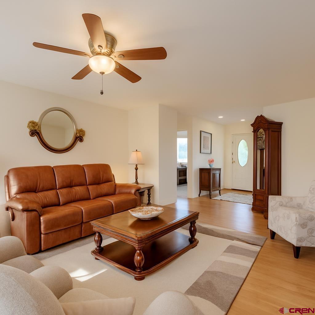 1711 Golf Course Lane Cortez, CO 81321 - Photo 14 of 45 a living room with furniture and wooden floor