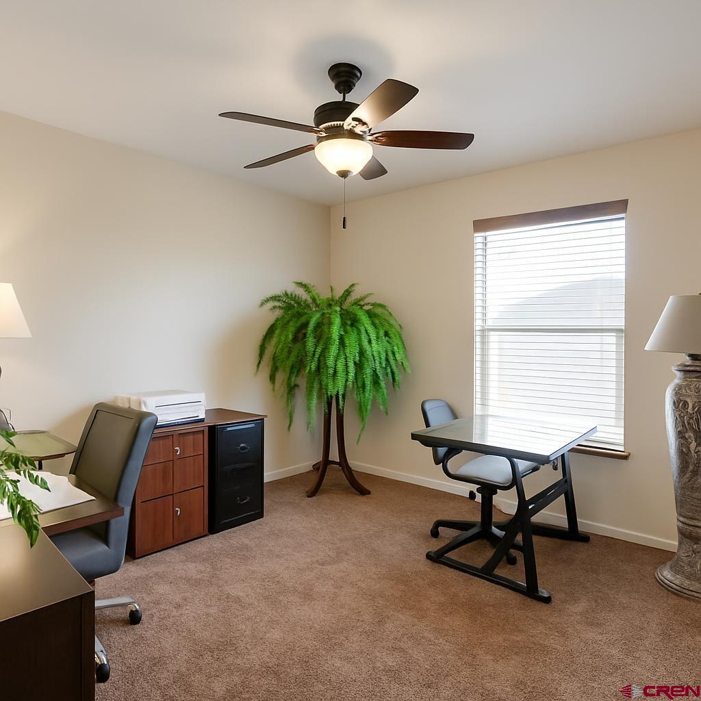 1711 Golf Course Lane Cortez, CO 81321 - Photo 28 of 45 a living room with furniture and a window