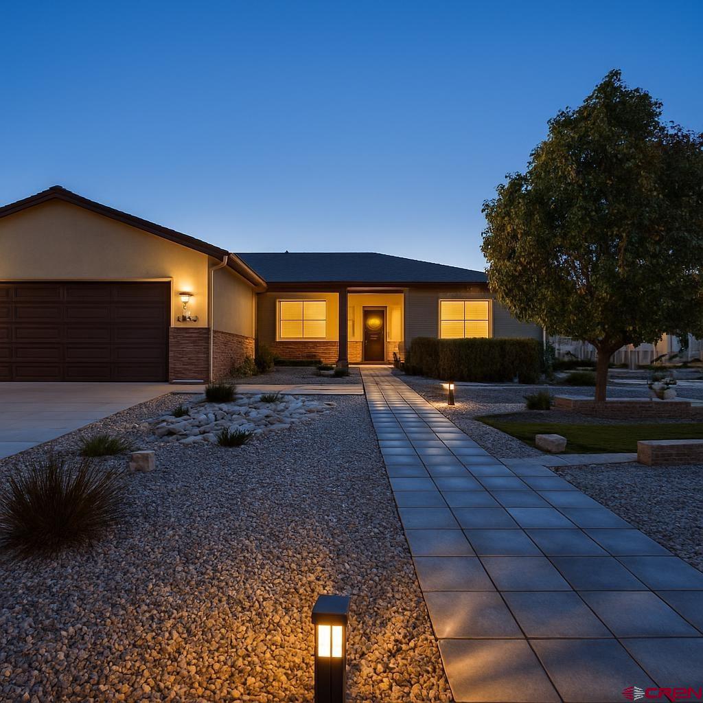 1711 Golf Course Lane Cortez, CO 81321 - Photo 3 of 45 a house view with a garden space
