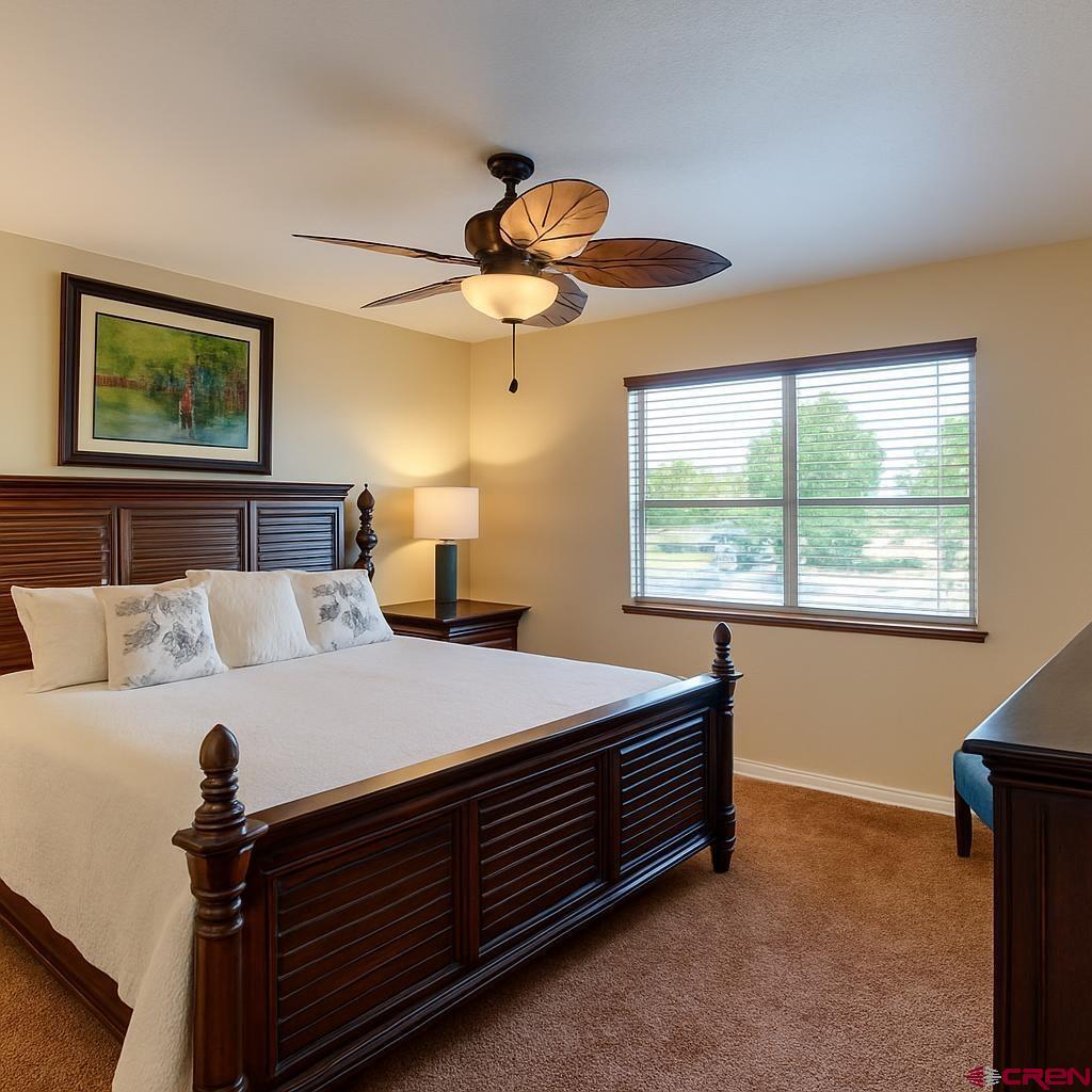 1711 Golf Course Lane Cortez, CO 81321 - Photo 31 of 45 a bedroom with a bed and a window