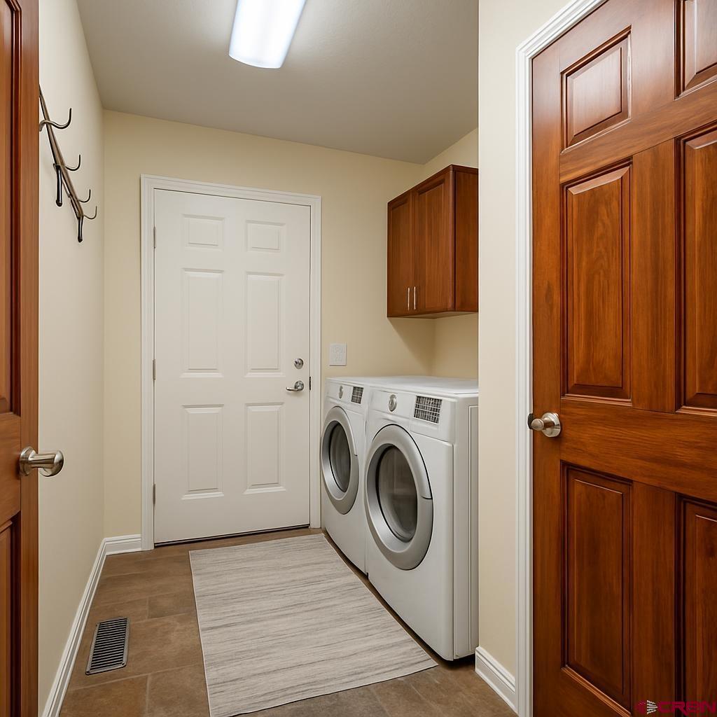 1711 Golf Course Lane Cortez, CO 81321 - Photo 37 of 45 a utility room with dryer and washer