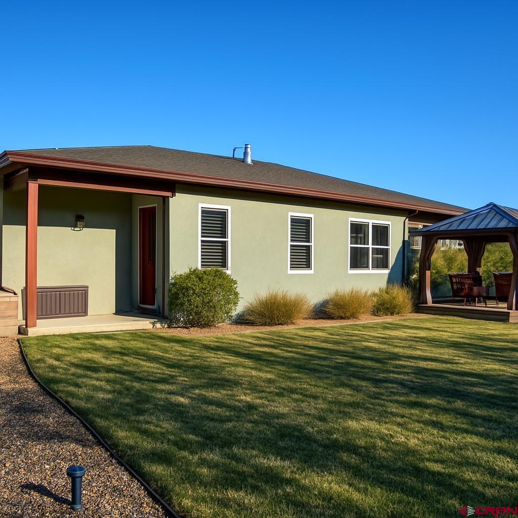 1711 Golf Course Lane Cortez, CO 81321 - Photo 8 of 45 a view of a house with a big yard