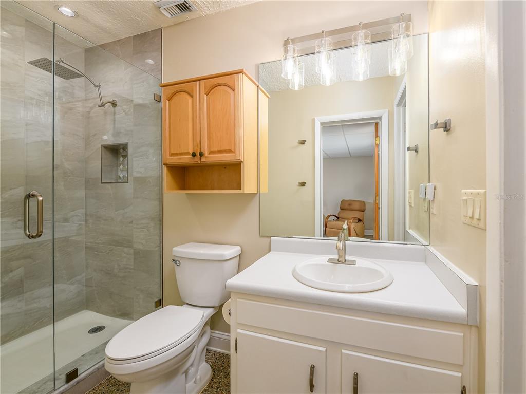907 Hillside Terrace Brandon, FL 33511 - Photo 18 of 35 a bathroom with a sink a toilet and shower