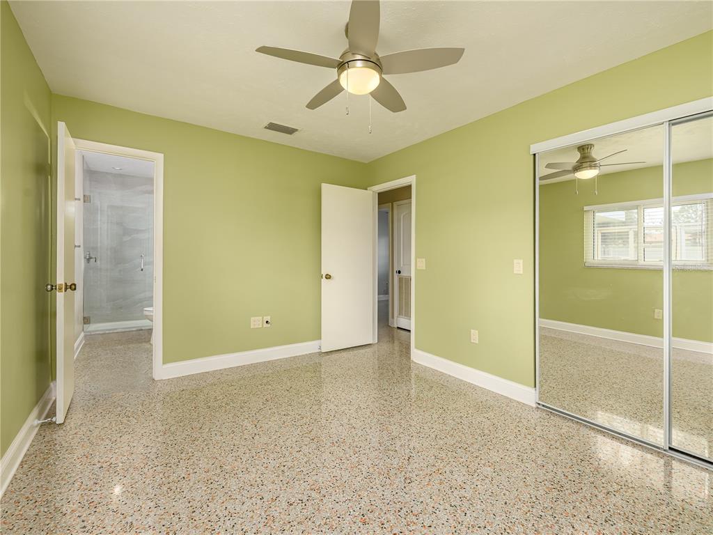 907 Hillside Terrace Brandon, FL 33511 - Photo 22 of 35 a view of an empty room with a ceiling fan