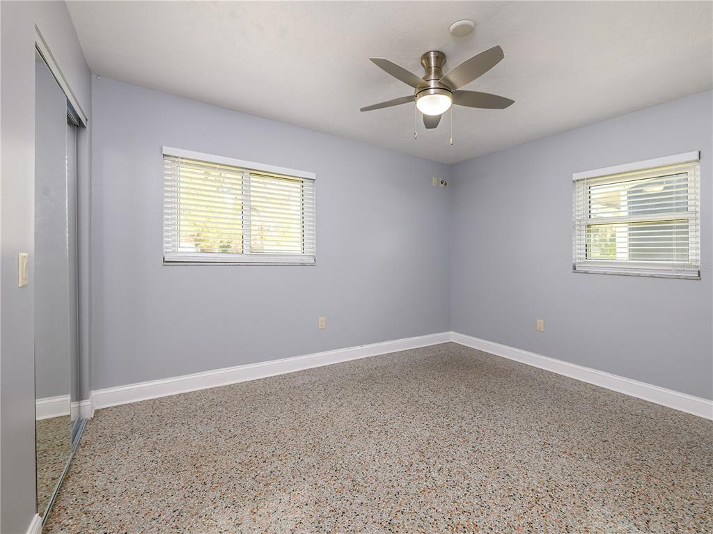 907 Hillside Terrace Brandon, FL 33511 - Photo 23 of 35 an empty room with windows and ceiling fan