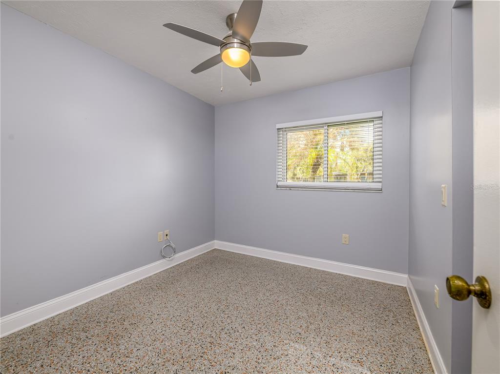 907 Hillside Terrace Brandon, FL 33511 - Photo 25 of 35 an empty room with windows and fan