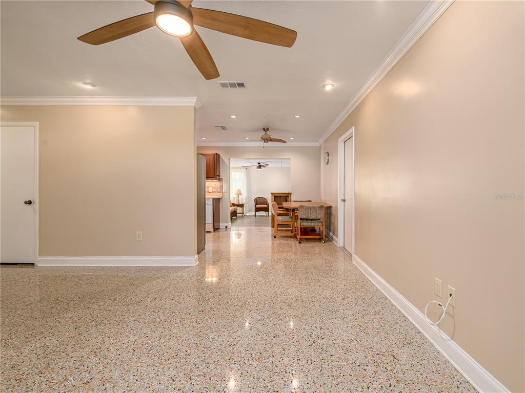 907 Hillside Terrace Brandon, FL 33511 - Photo 6 of 35 a view of a livingroom with furniture and a ceiling fan