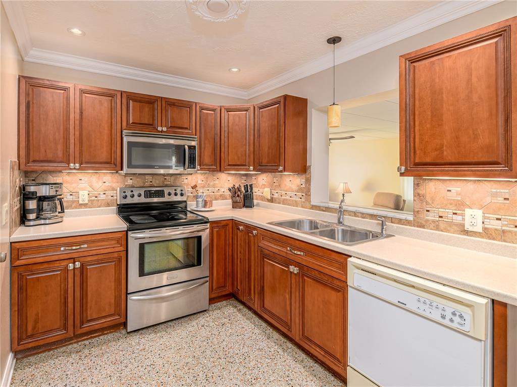 907 Hillside Terrace Brandon, FL 33511 - Photo 9 of 35 a kitchen with a sink stove top oven and microwave